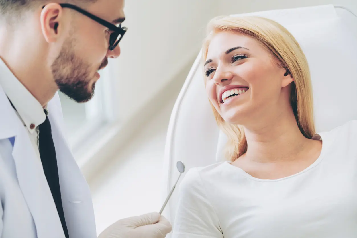 Dentist With Female Dental Implants Patient