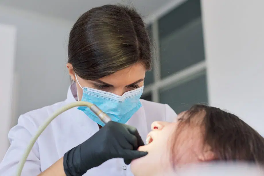 female dentist caring for patient