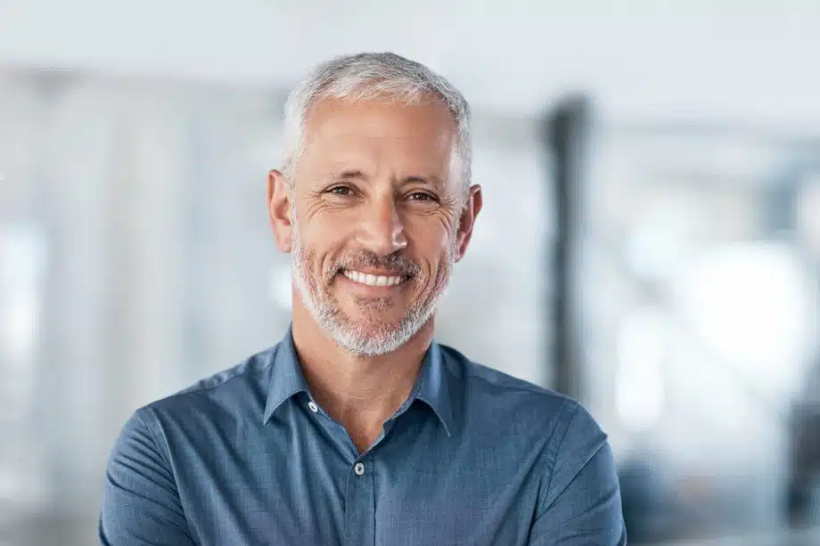 smiling man with gray hair and beard